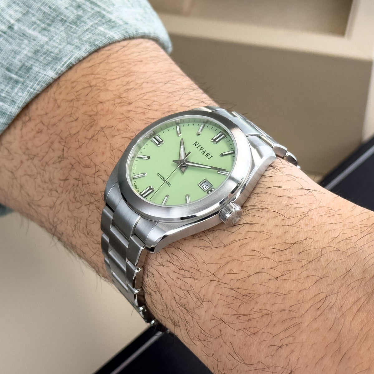 Eden worn on the wrist, showing its slim, balanced profile.