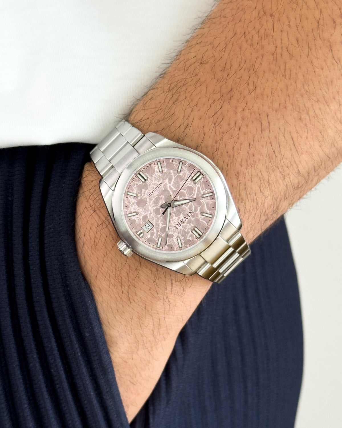 Eden worn on the wrist, showing its slim, balanced profile.