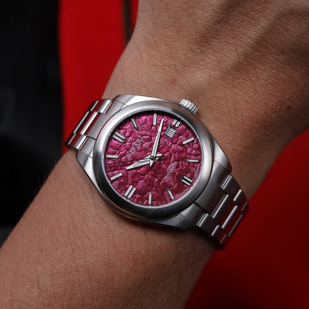 Eden worn on the wrist, showing its slim, balanced profile.